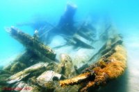 The wreck of the Solon Johnson viewed from the stern with the upright steam engine in the background.